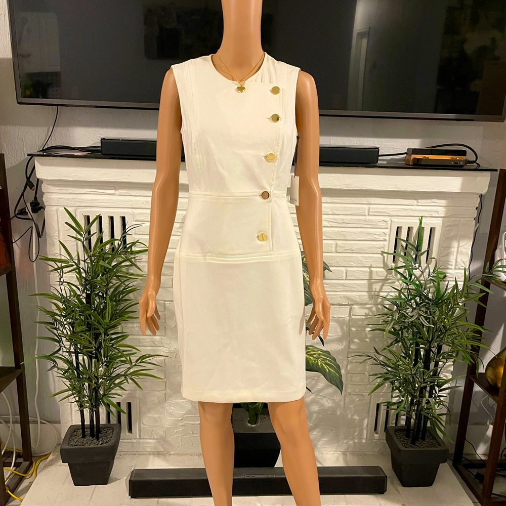 Elegant Beautiful white dress with gold design.